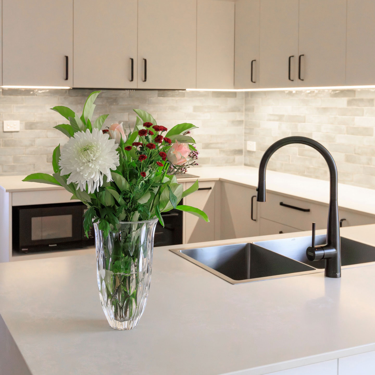 Finished kitchen renovation showcasing workspace and storage