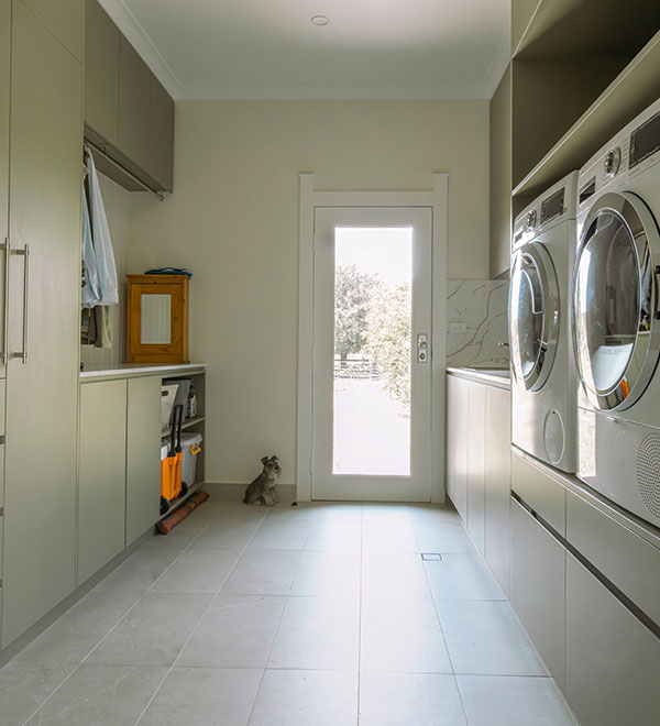 Modern laundry renovation in Canberra with efficient layout, storage solutions, and stylish finishes by Timeless Projects.